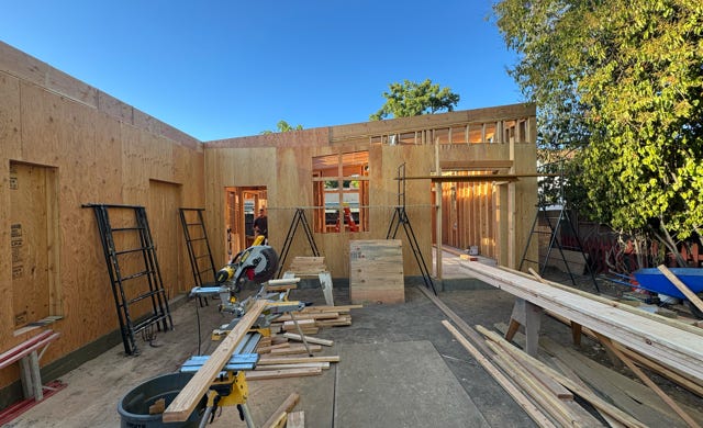 site plan with new floor plan layout at new ADU and at new addition to existing residence